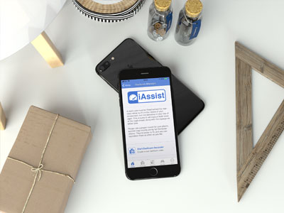 Phone showing iAssist on a desk